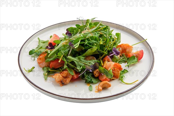 Salad with shrimps and fresh vegetables isolated on white background