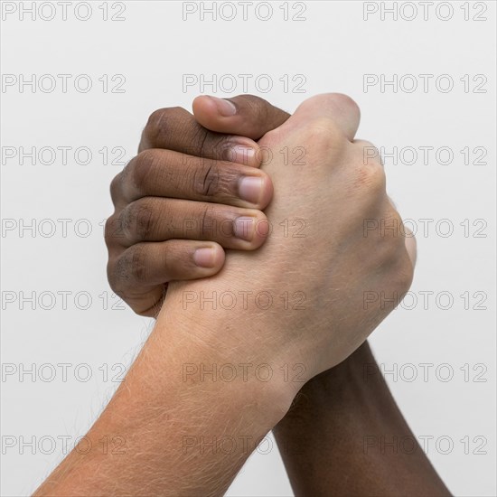 Multiracial hands coming together 1