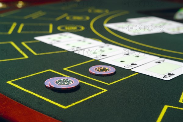 Casino black jack table with chips and cards. Winning combination