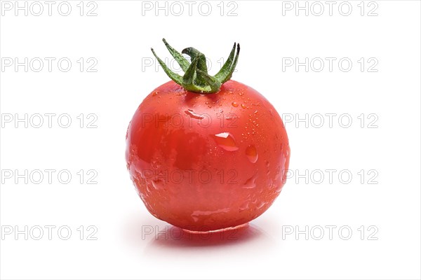 Fresh wet tomato cherry isolated on white background