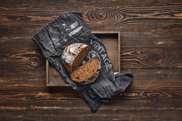 Fresh rye brown bread on wooden cutting board