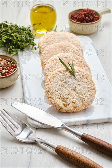 Semifinished chicken cutlet in breading ready for frying