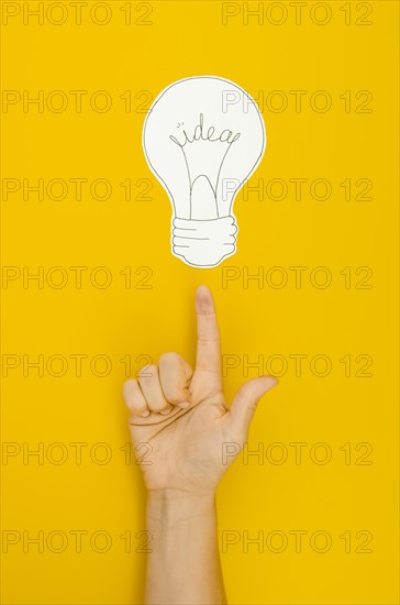 Hand pointing lighten bulb