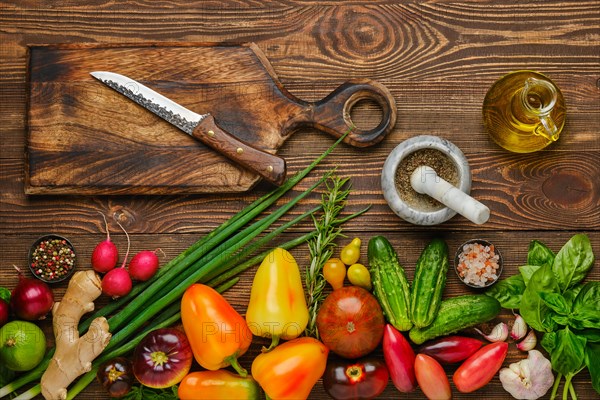 Top view of wooden table with different vegetables for salad. Healthy eating concept