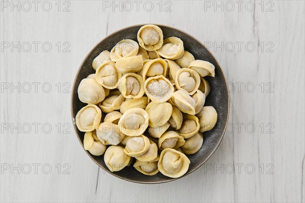 Top view of homemede meat dumplings on white wooden table