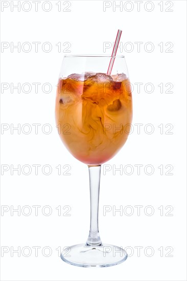 Cold brew coffee in a wine glass isolated on white