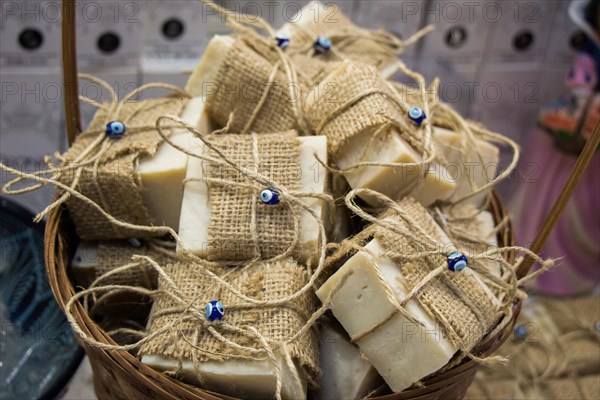 Collection of bars of fragrant hand made organic soap in a basket