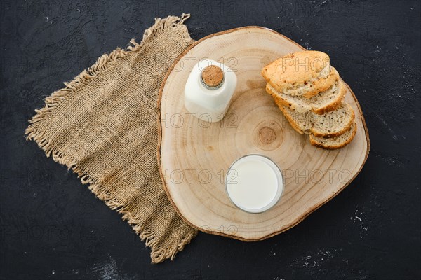 Top view of bottle and a glass of fresh milk