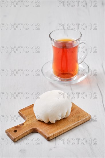 Sweet dessert mochi with coconut chips with fruit tea