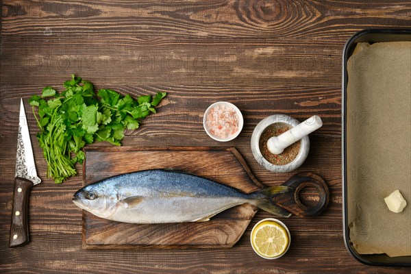 Fresh sea yellow tailed horse mackerel ready for cooking with ingredients