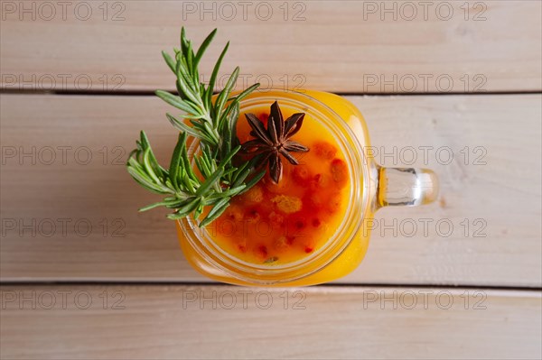 Cup of sea buckthorn tea with citrus