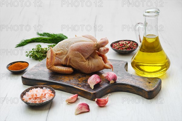 Fresh whole chicken chick and spice ready for cooking