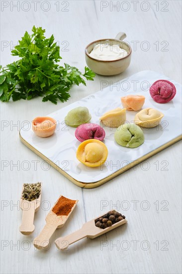 Colorful meat dumplings on marble serving plate