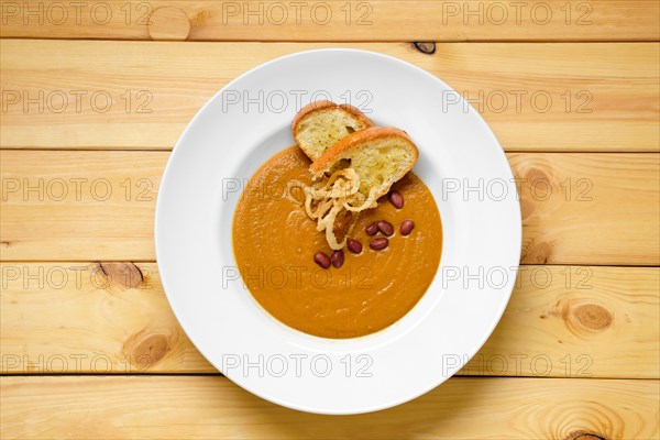 Top view of beans cream soup with croutons