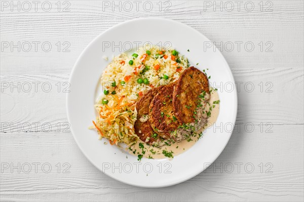 Top view of plate with liver cutlet