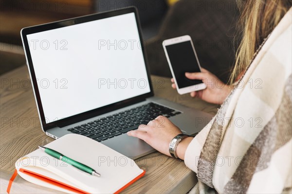 Businesswoman using laptop coffee shop