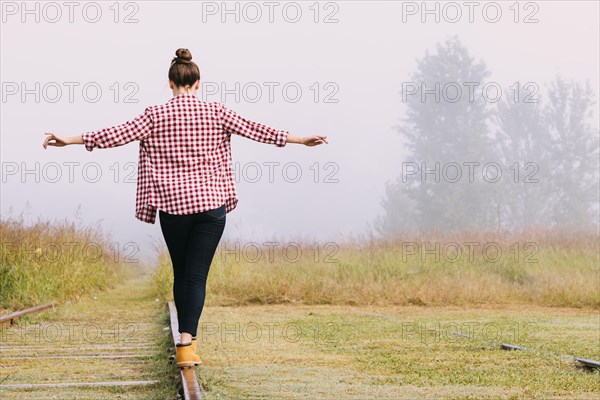 Young girl balancing railway. Resolution and high quality beautiful photo