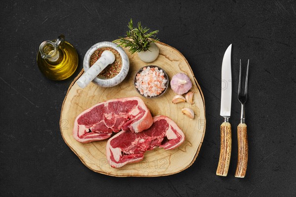 Overhead view of raw fresh lamb double loin chop ready for cooking