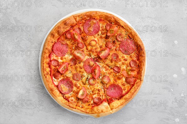 Overhead view of pizza pepperoni with two kind of sausages