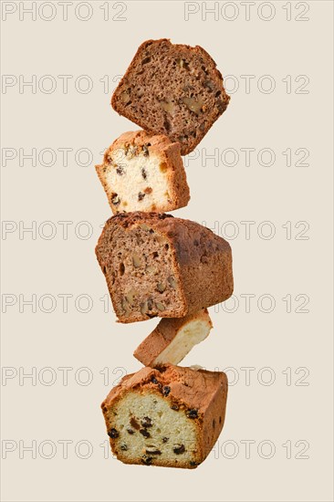 Stacked pieces of biscuit cupcakes. Balancing cakes