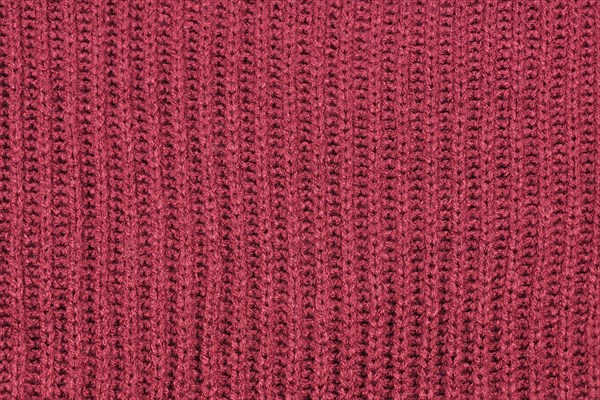 Close up of knitted pattern on blue wool pullover