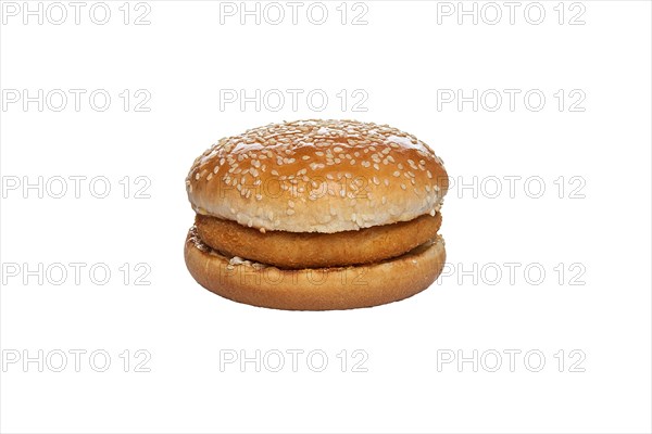 Bun with sesame and cutlet inside isolated on white background
