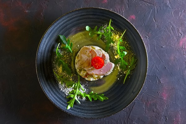 Olivier salad with slices of turkey