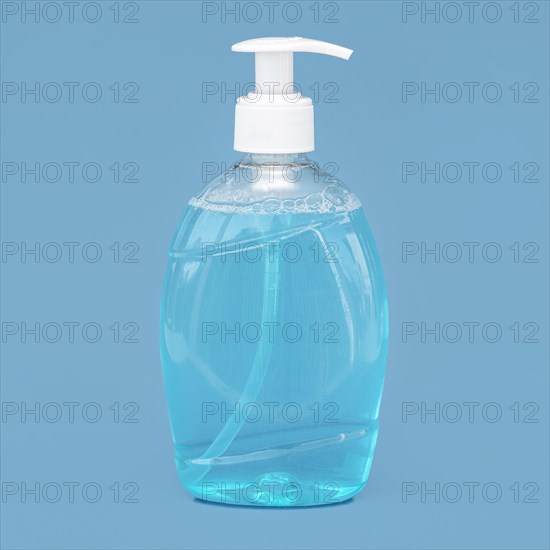 Transparent bottle liquid soap blue background. Resolution and high quality beautiful photo