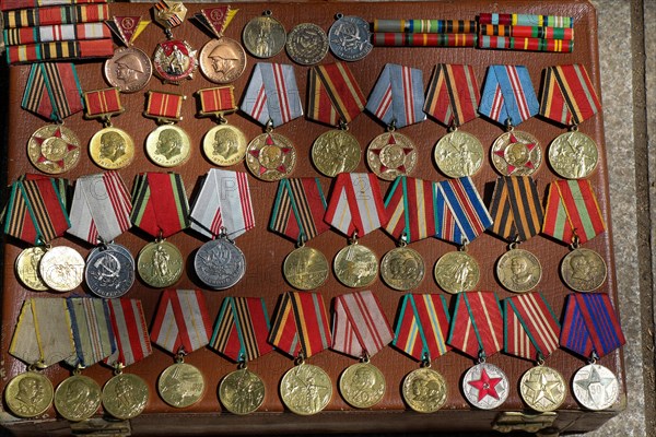 Veteran medals for their labour scattered on a table