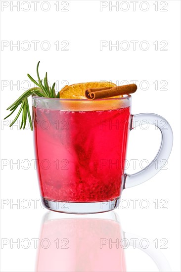 Glass of hot cranberry drink isolated on white background