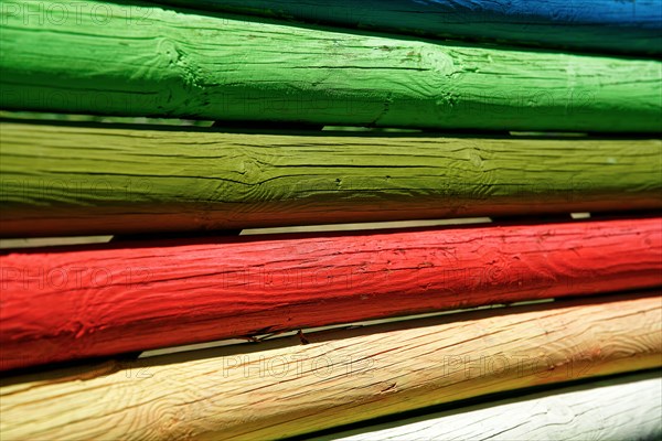 Coloured wooden posts on children's playground