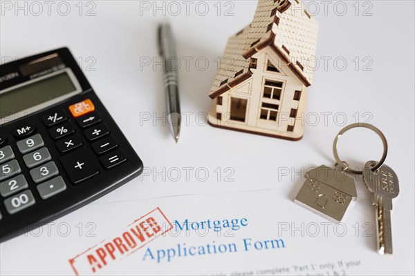 Mortgage contract house figurine