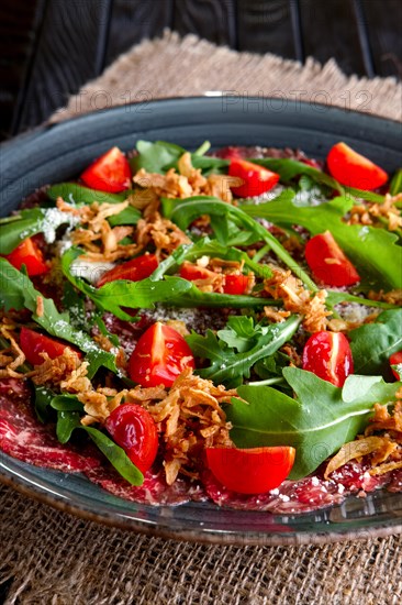 Beef carpaccio with tomato cherry