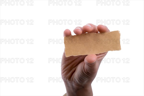 Hand holding a piece of blank torn notepaper