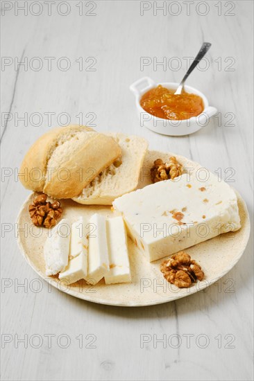 Healthy rustic breakfast. Homemade curd cheese with raisin and walnut