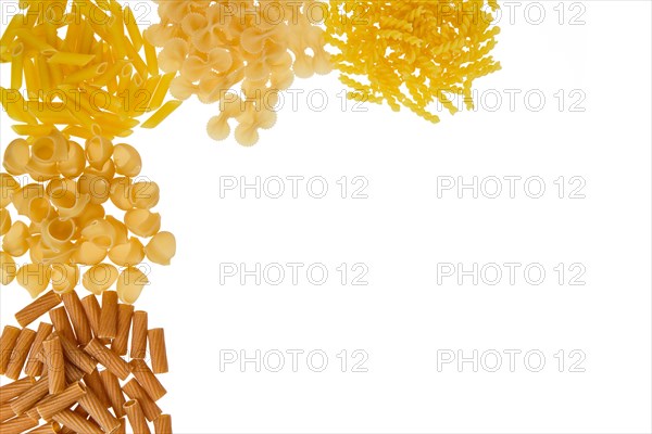 Overhead view of various kinds of pasta isolated on white background