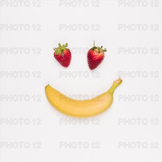 Red strawberry yellow banana white background