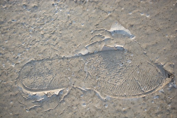 Footstep pattern seen on a concrete background