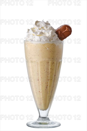 Milkshake with whipped cream and chocolate bar isolated on white background