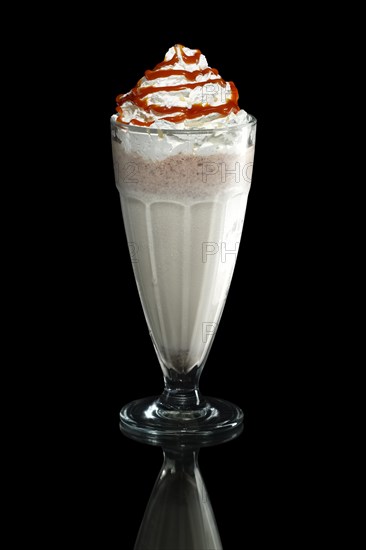 Milkshake caramel summer cocktail isolated on black