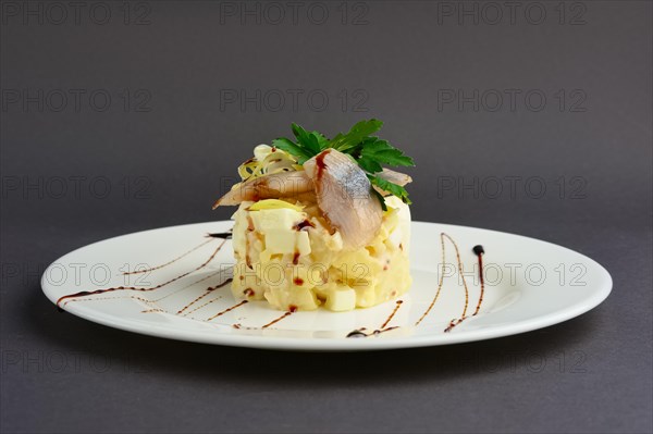 Side view of salad with herring