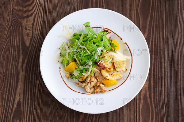 Top view of salad with fried chicken meat