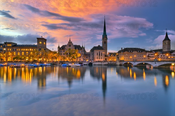 Local view of the illuminated old town of Zurich after sunset