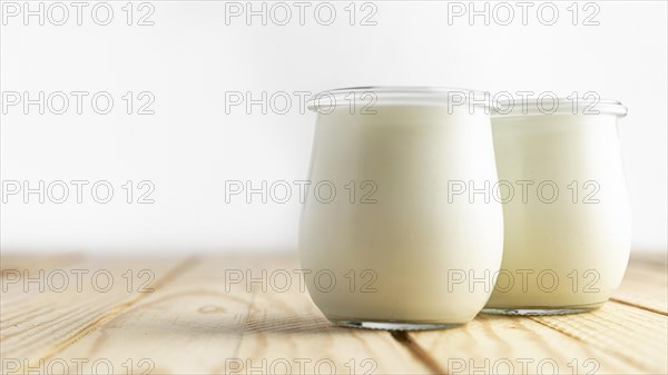 Front view plain yogurt in jars