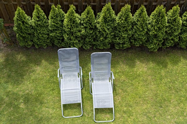 Two garden loungers in a meadow