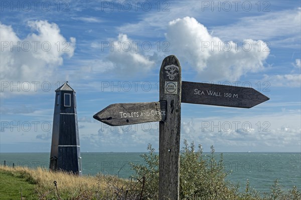 Tower and signpost