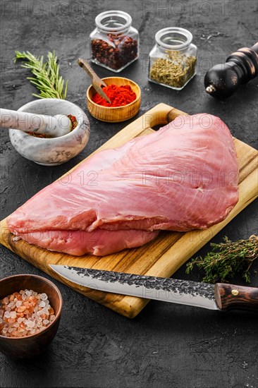 Raw fresh turkey breast with spices