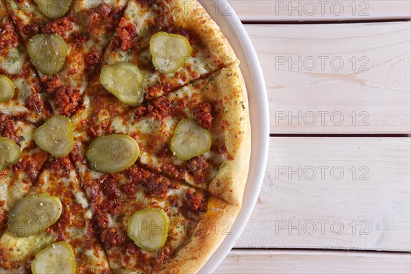 Double cheese pizza with pickled cucumber