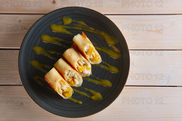 Thin pancakes with chicken and pineapple