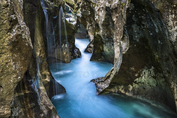 Mountain river Soca flows through narrow canyon